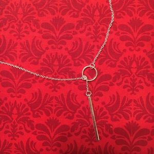 Silver lariat necklace.